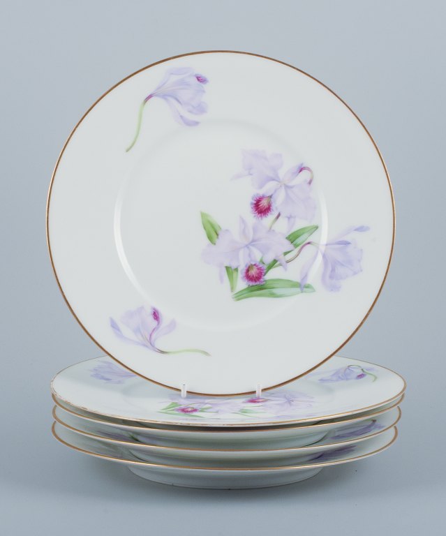 Royal Copenhagen, a set of five Art Nouveau plates hand-painted with lilies and 
gold trim.