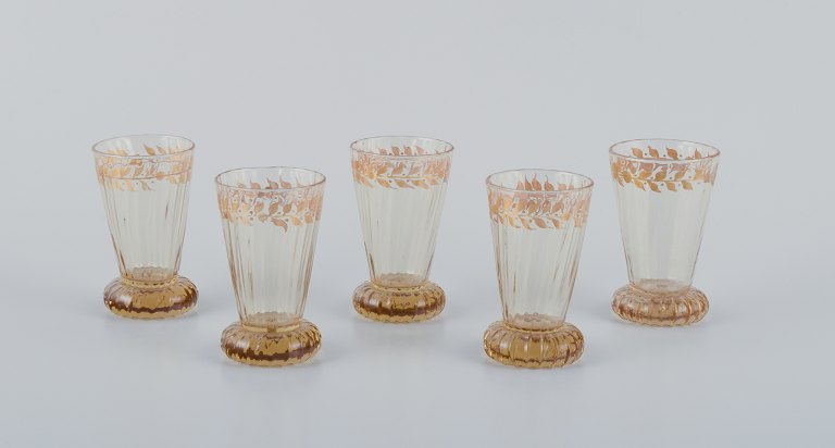 Emile Gallé (1846-1904), French artist and designer.
Five small crystal glasses hand-decorated with gold leaf motifs.