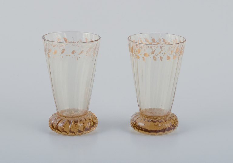 Emile Gallé (1846-1904), French artist and designer.
Two small crystal glasses hand-decorated with gold leaf motifs.