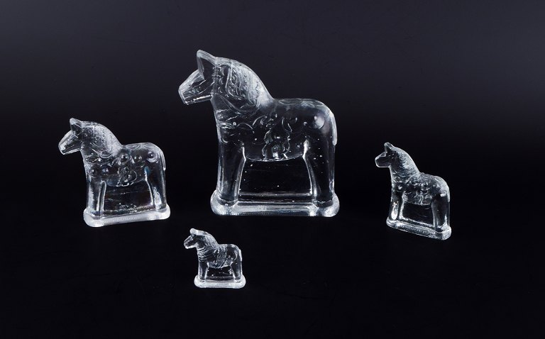 Swedish glass artist, four Dala horses in clear mouth-blown art glass.