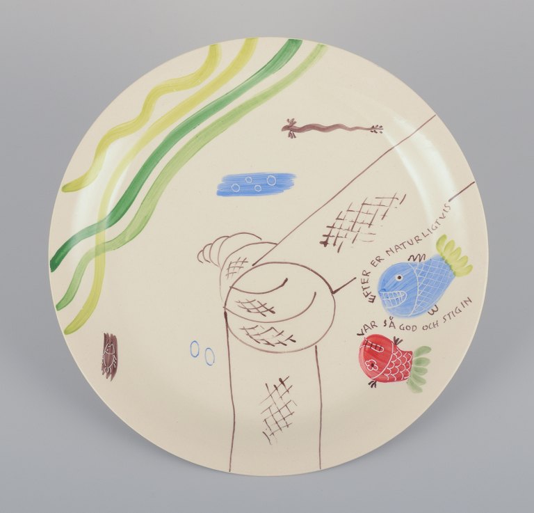 Stig Lindberg for Gustavsberg. "Löja" plate. Hand-painted with a fish motif. 
Satirical illustration with Swedish text.