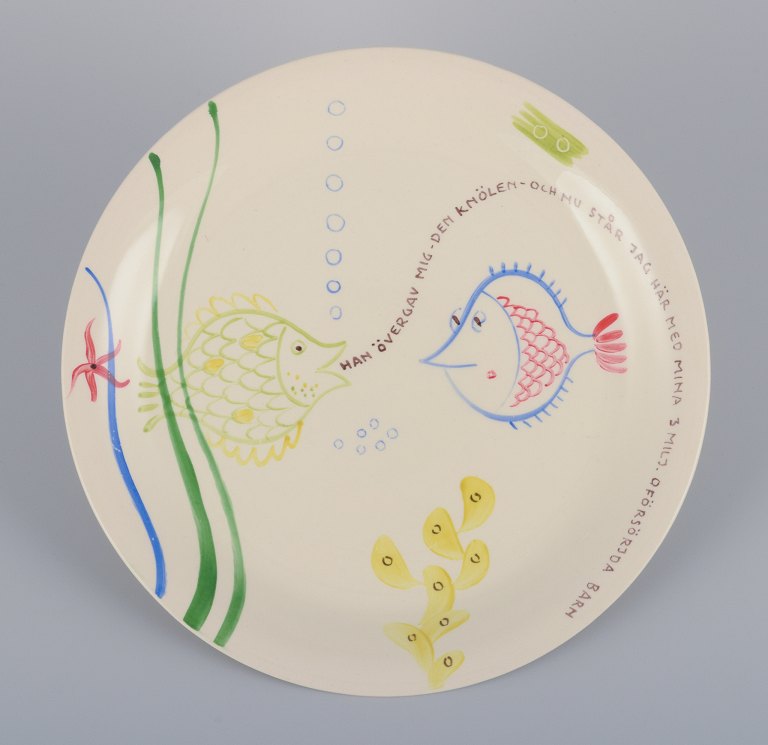 Stig Lindberg for Gustavsberg. "Löja" plate. Hand-painted with a fish motif. 
Satirical illustration with Swedish text.