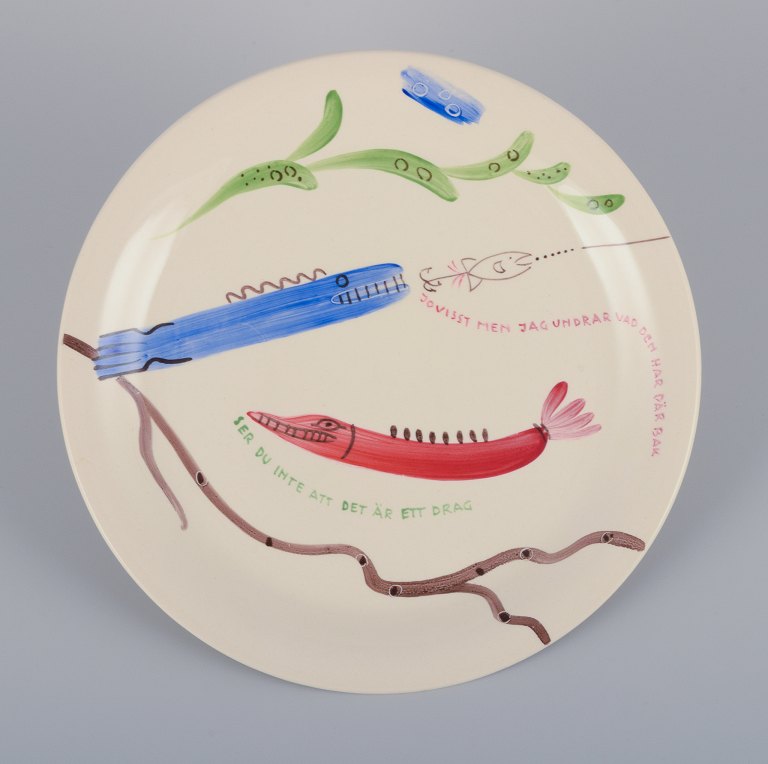 Stig Lindberg for Gustavsberg. "Löja" plate. Hand-painted with a fish motif. 
Satirical illustration with Swedish text.