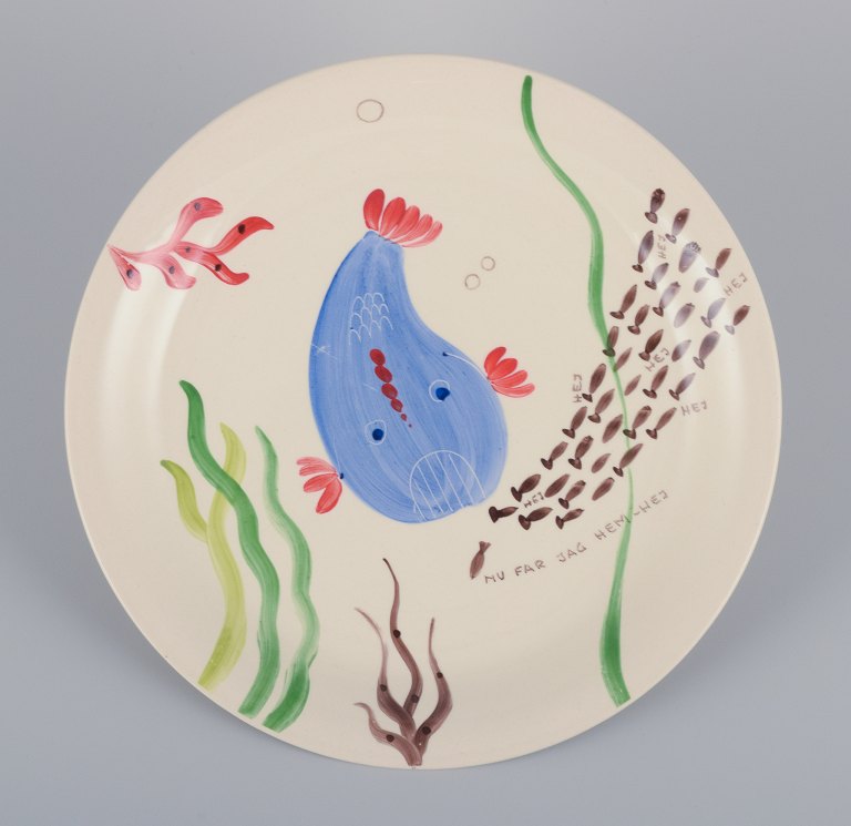 Stig Lindberg for Gustavsberg. "Löja" plate. Hand-painted with a fish motif. 
Satirical illustration with Swedish text.