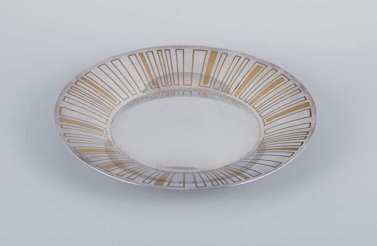 WMF, Germany. Large "Ikora" Art Deco bowl with three feet, silver-plated with 
brass inlay.