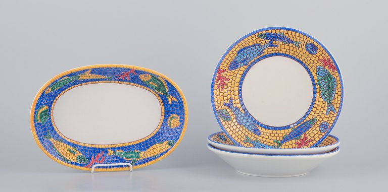 Vietri, Italy. Set of three large deep plates and a rectangular dish in ceramic. 
Decorated with fish and sea motifs in a mosaic-like pattern.