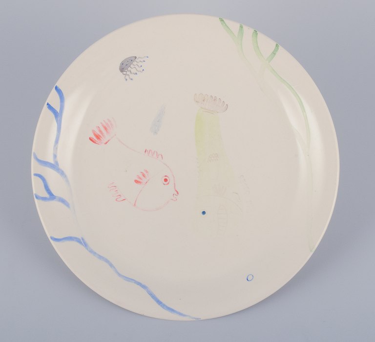 Stig Lindberg for Gustavsberg. "Löja" plate. Hand-painted with a fish motif. 
Satirical illustration with Swedish text.