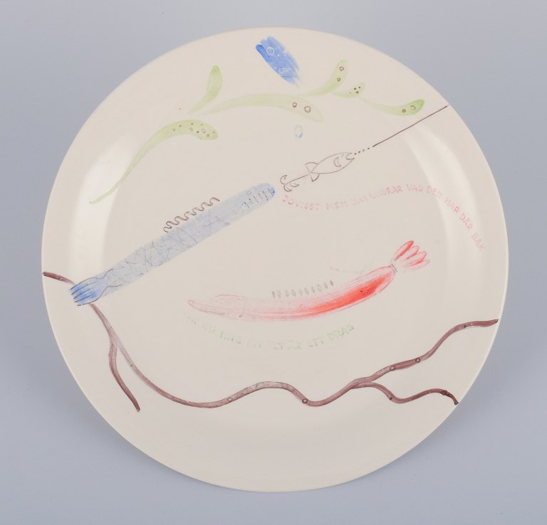 Stig Lindberg for Gustavsberg. "Löja" plate. Hand-painted with a fish motif. 
Satirical illustration with Swedish text.