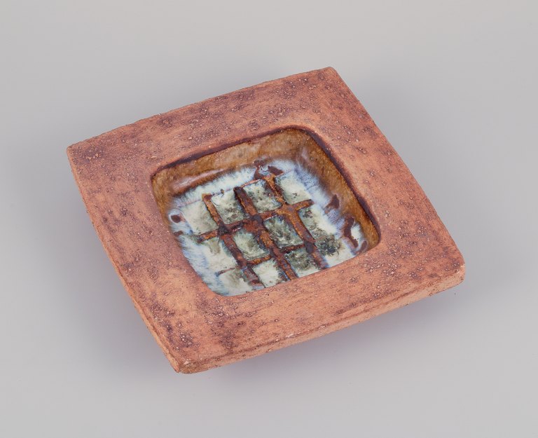 Curt Magnus Addin, own workshop, Swedish ceramic artist.
Large square bowl with an abstract design.