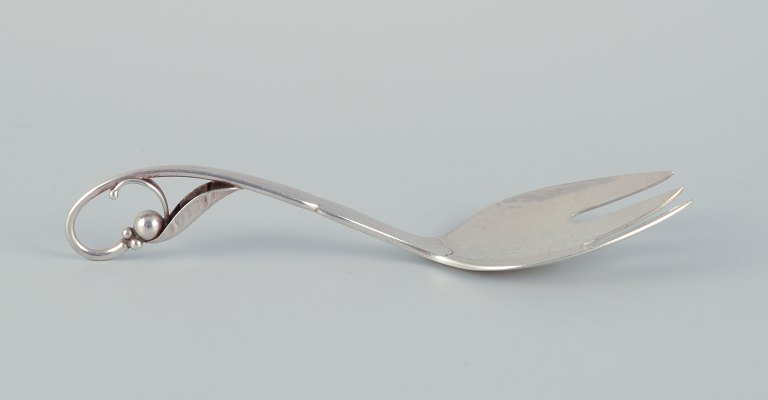 Georg Jensen serving-fork with openwork foliage. Sterling silver.