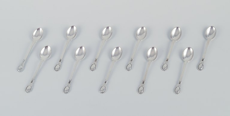 Evald Nielsen No 13, a set of eleven coffee spoons in 830 silver.
Hammered finish.