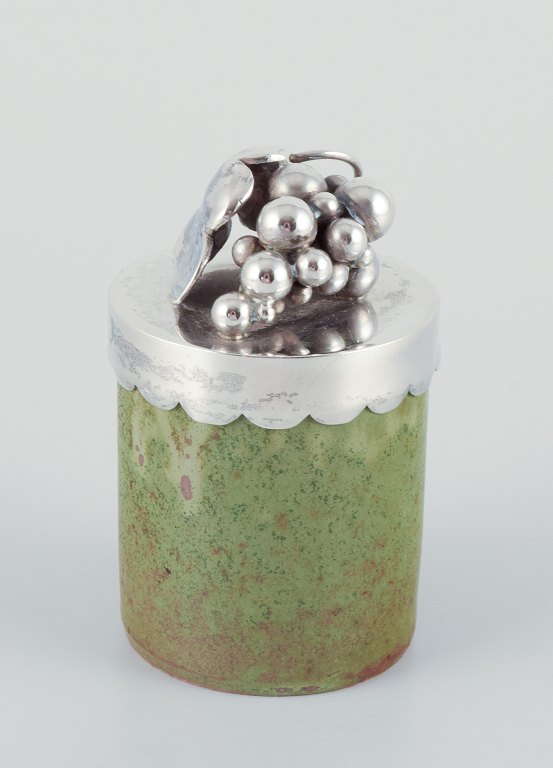 Arne Bang/Aage Weimar, lidded jar. Ceramic jar with green-toned glaze, sterling 
silver lid. Adorned with a cluster of grapes.