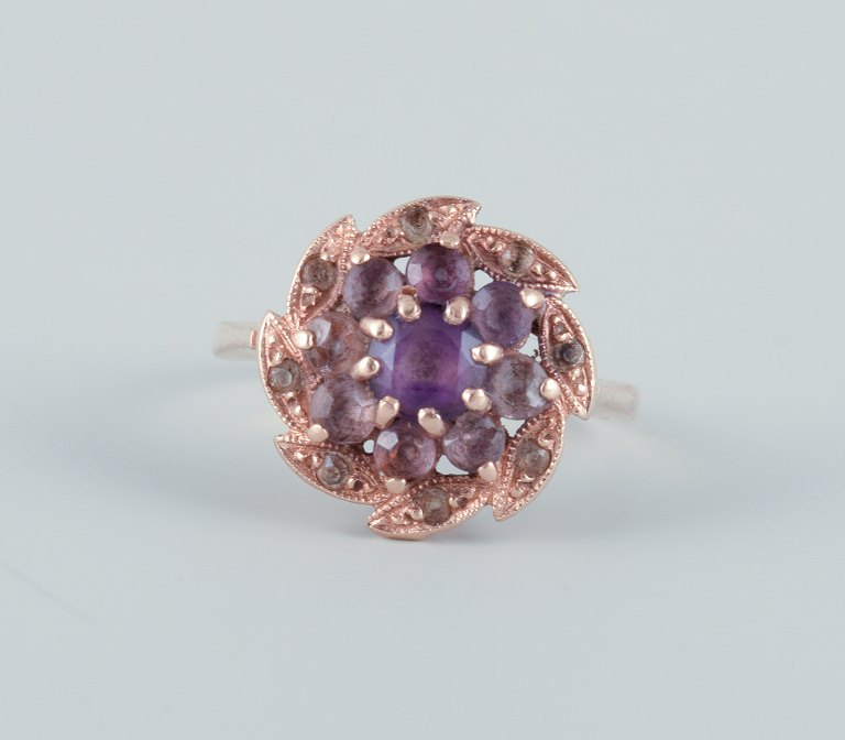 Danish goldsmith, 14 karat gold ring adorned with a purple semi-precious stone. 
Art Deco style.