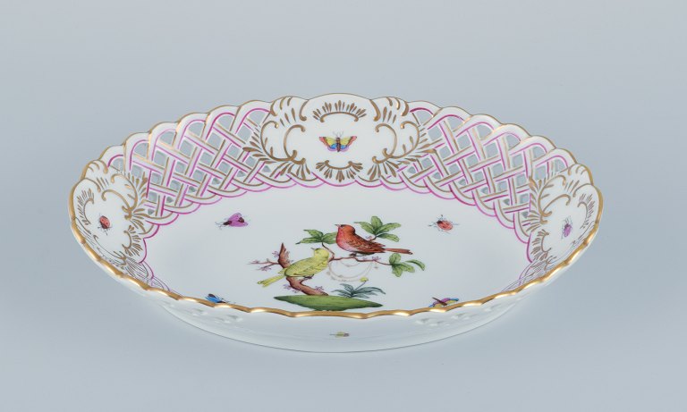 Herend, Hungary. Oval open lace porcelain bowl hand-painted with butterflies and 
birds on branches. Gold rim.