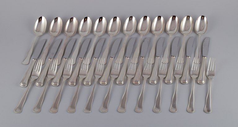 Cohr, Danish silversmith. "Old Danish". A complete twelve-person dinner set 
consisting of twelve dinner knives, twelve dinner forks, and twelve dinner 
spoons in 830 silver.