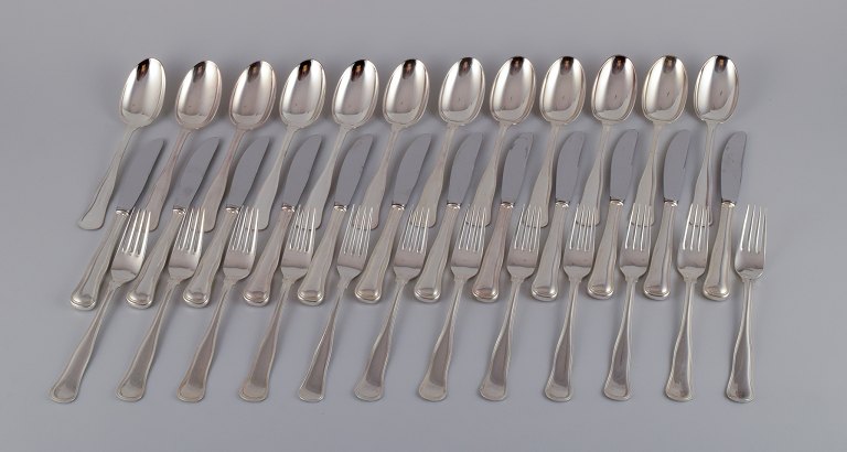 Cohr, Danish silversmith. "Old Danish". A complete twelve-person dinner set 
consisting of twelve dinner knives, twelve dinner forks, and twelve dinner 
spoons in 830 silver.