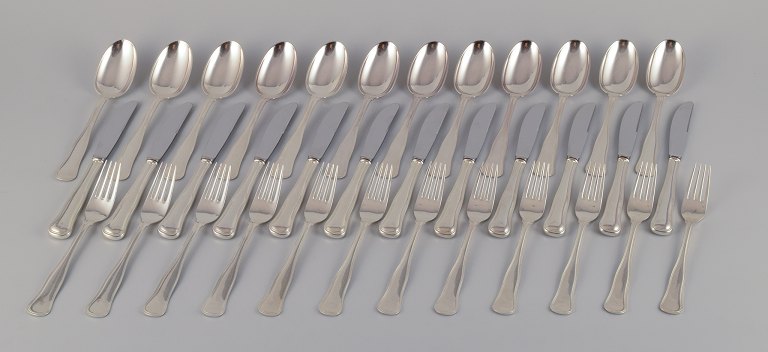 Cohr, Danish silversmith. "Old Danish". A complete twelve-person lunch set 
consisting of twelve lunch knives, twelve lunch forks, and twelve dessert spoons 
in 830 silver.