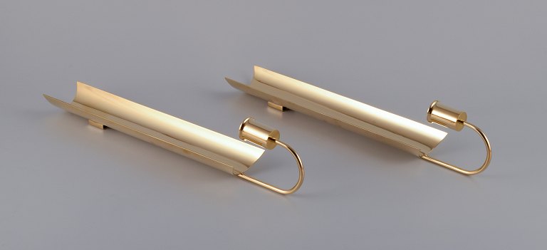 Pierre Forssell for Skultuna. A pair of "Reflex" wall-mounted candle holders.