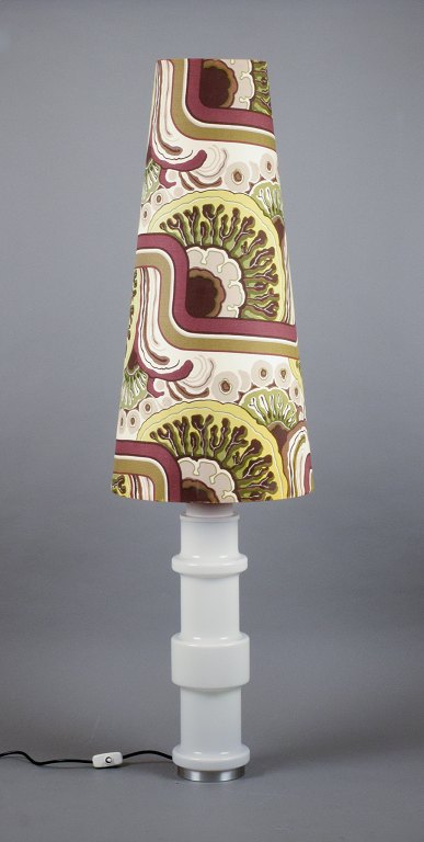 Swedish design. Colossal floor lamp in glass with a large shade in 1970s textile 
design.