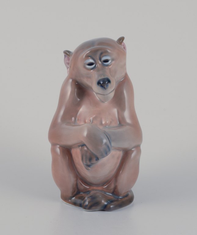 Royal Copenhagen. Porcelain figurine of a monkey.
Design by Niels Nielsen 1913.