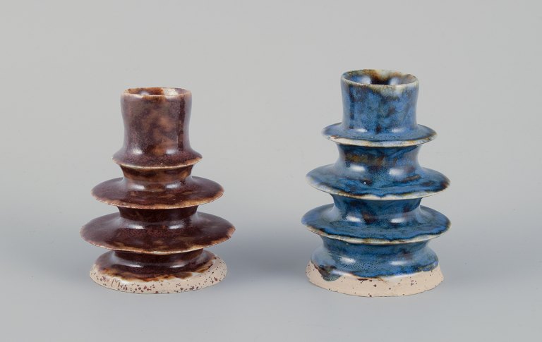 European studio ceramicist. Two unique ceramic candleholders. Glaze in blue and 
brown shades.