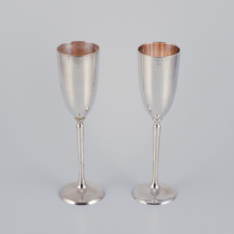 Gunilla Lindahl for Scandia Present, Sweden. Two large champagne flutes in 
plated silver.