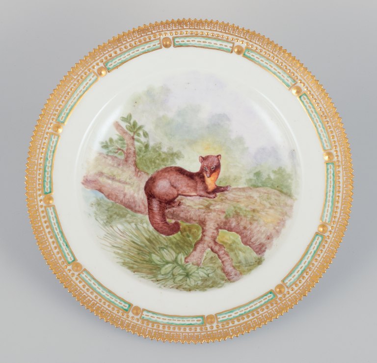 Royal Copenhagen Fauna Danica dinner plate with a motif of a pine marten in a 
landscape.