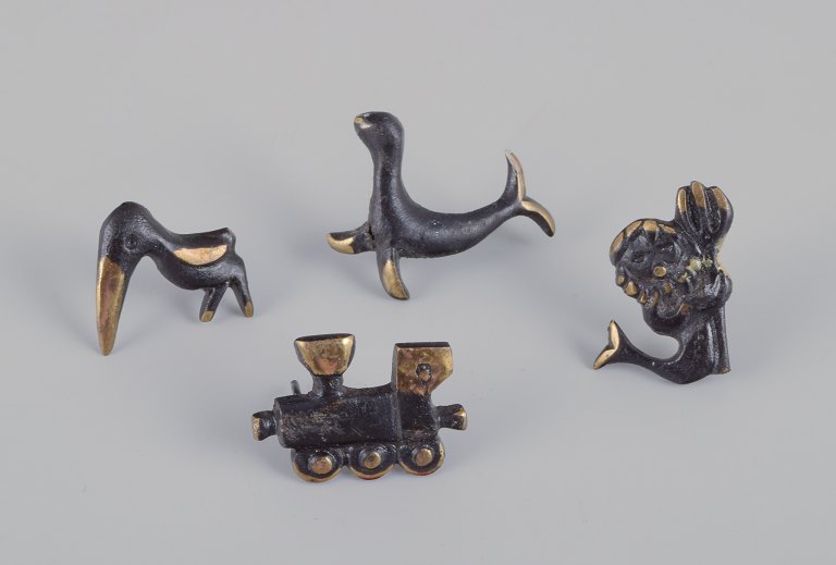 Walter Bosse (1904-1979), Austria.
Four miniature bronze figurines. Train, mermaid, toucan, and seal.