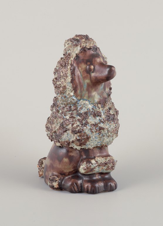 EGO Lidköping, Stoneware, Sweden. Ceramic figure of a standard poodle. Glazed in 
brownish-green hues.