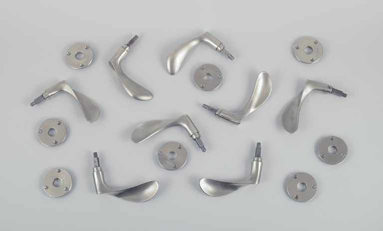Arne Jacobsen (1902-1971). Four pairs of door handles made of patinated white 
bronzed metal with fittings.