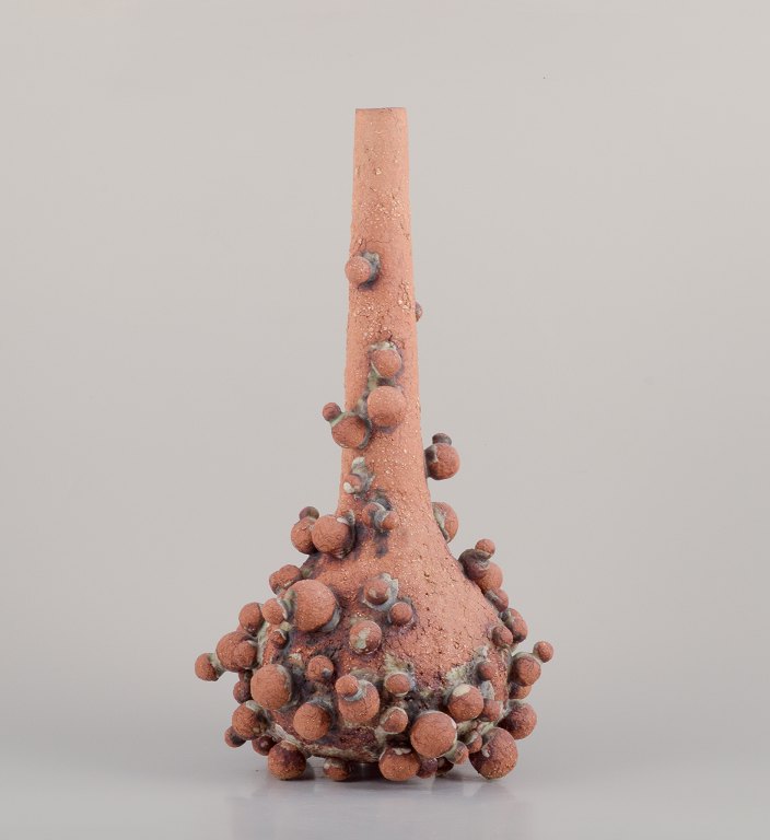 Christina Muff, Contemporary Danish ceramic artist (born 1971).
Very tall vessel covered in clay balls.