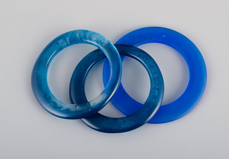 French jewelry designer.
Three bracelets in blue plastic.