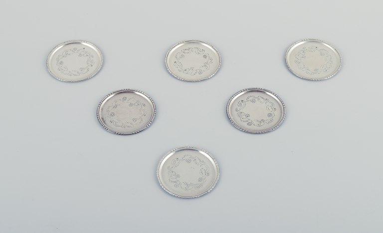 Georg Jensen, a set of six glass coasters in sterling silver.