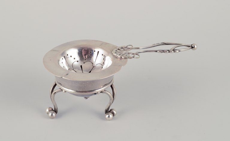 Georg Jensen, early tea strainer with holder. 830 silver.