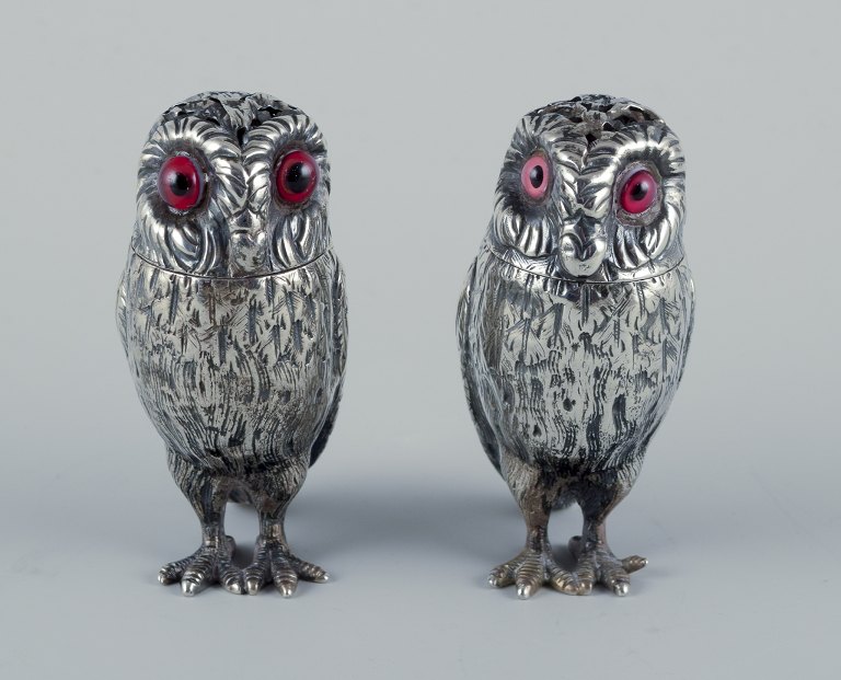 Edward Charles Brown
Rare set of salt and pepper shakers shaped like owls with inserted red glass 
eyes.