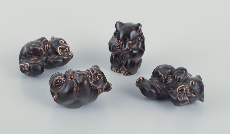 Knud Kyhn for Royal Copenhagen. Four stoneware figures of brown bear cubs.