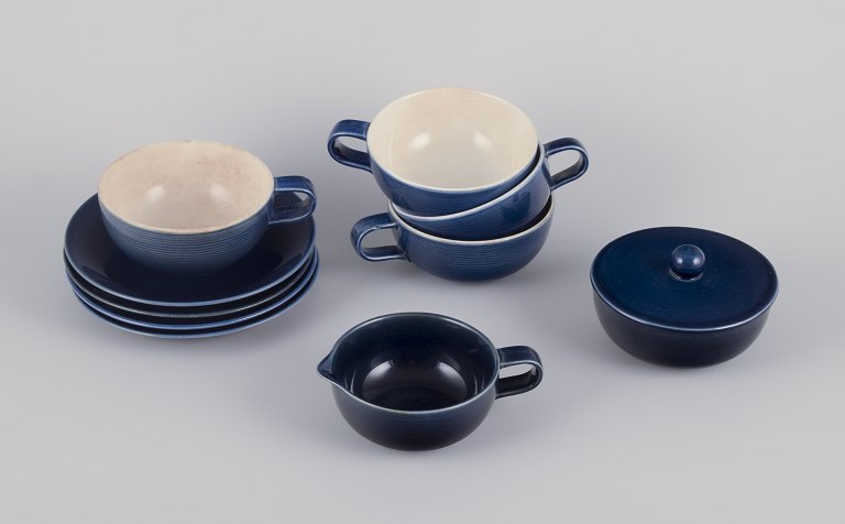 Gertrud Lönegren for Rörstrand, Sweden.
Set of four "Blå Blanche" teacups with saucers, a sugar bowl, and creamer.