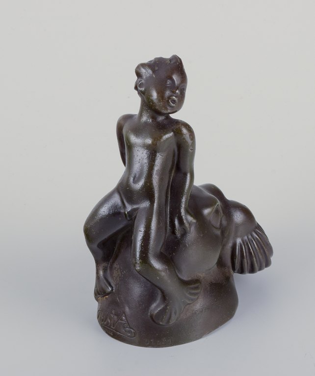 Just Andersen, Denmark.
Figurine of a boy sitting on the head of a walrus.