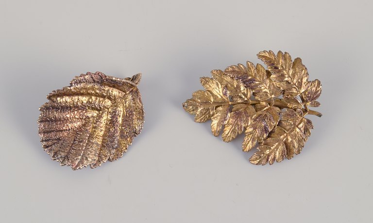 Flora Danica Jewellery, produced by Eggert. 
Two leaf-shaped brooches gilded in sterling silver.