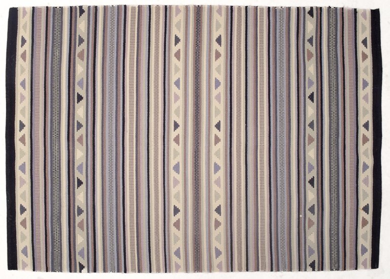 Swedish textile designer.
Hand-knotted wool rug. 
Woven in several colors.