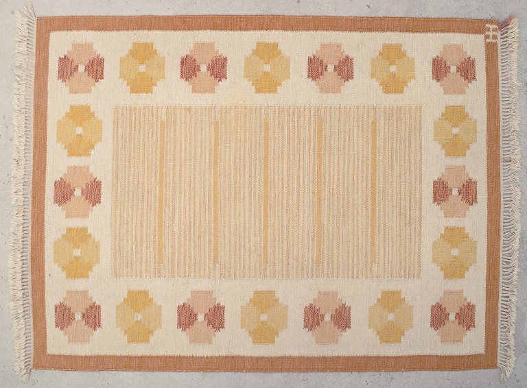 Swedish textile designer.
Handwoven rug made of wool. Rölakan technique. 
Woven with geometric pattern.