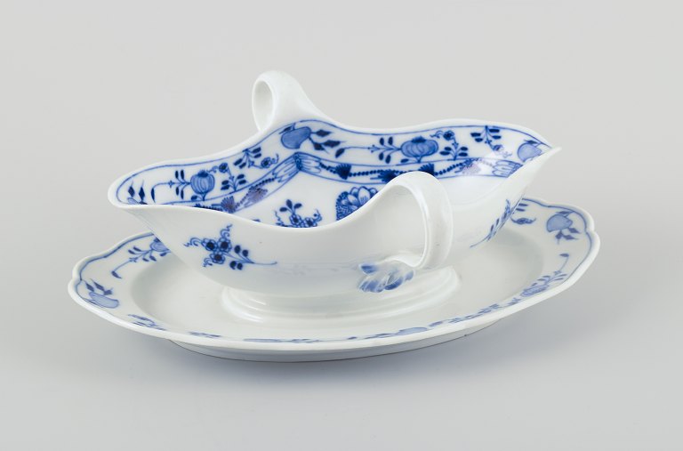 Meissen, Germany. Blue Onion porcelain gravy boat with two handles on a foot.