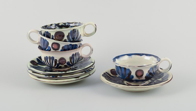 Nils Joakim Kähler for Kähler. A set of four "Marguerit" teacups and saucers 
made of glazed stoneware.