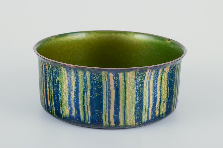 Norwegian designer.
Shiny enameled copper bowl.
Green and blue tones.