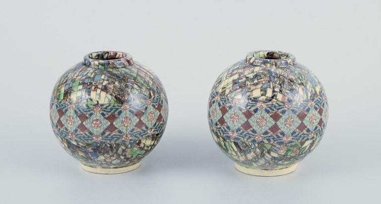 Jean Gerbino for Vallauris, French ceramicist.
A pair of small round stoneware vases.