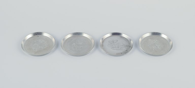 Just Andersen, a set of four pewter glass trays.
Grooved edge. With incised motifs from fairy tales.