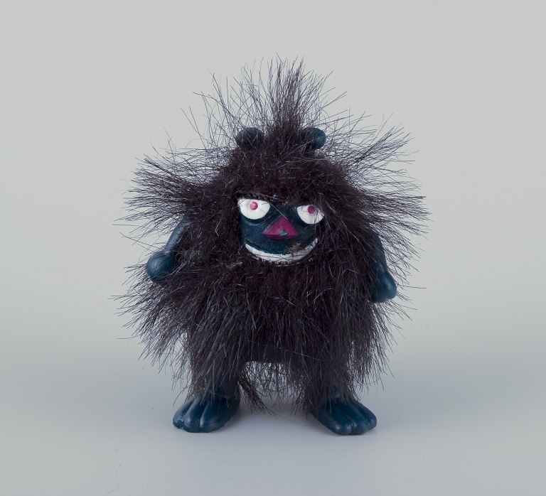 Martinex, Finland. ‘Stinky’ Mummy figure of dark blue plastic covered with black 
hair.