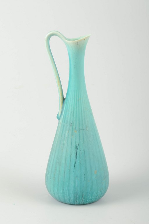 Rörstrand, Sweden
Pitcher in turquoise glaze with ribbed body and elegantly curved handle.