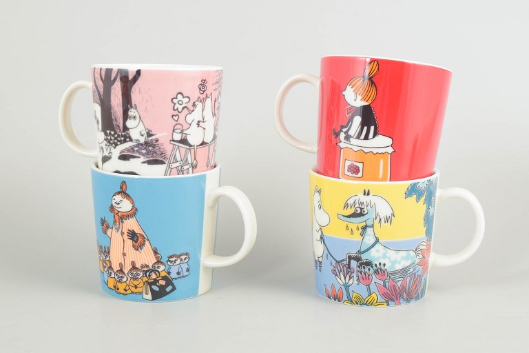Set of four Moomin Arabia mugs.