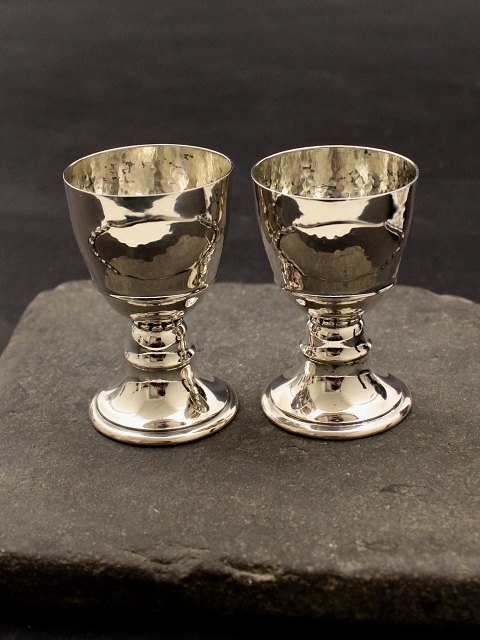 A pair of silver egg cups